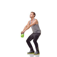 Image showing Training, fitness and studio man with kettlebell for muscle growth, strength development or weightlifting performance. Gym equipment, strong bodybuilder and male athlete lifting on white background