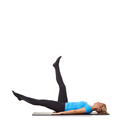 Image showing Woman, pilates and mat in studio for stretching, fitness or workout for healthy body, wellness or core muscle. Person, exercise or yoga on floor for health on mock up space or white background