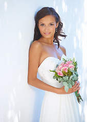 Image showing Event, wedding and bouquet with portrait of woman at venue for love, celebration and engagement. Ceremony, reception and fashion with bride and flowers in dress for happy, commitment and marriage