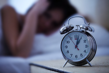 Image showing Alarm, clock and frustrated woman in a bed with hands on ears for noise, sound or alert at home. Time, bell and female person in a bedroom blur with fatigue, burnout or sleeping late from insomnia