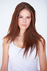 Image showing Beauty, portrait and woman in studio for hair, treatment or styling on white background. Haircare, damage and face of serious female model with shampoo, conditioner or repair results for color or dye