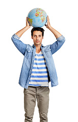 Image showing Serious, globe and portrait of man in a studio for world, planet or geography map for planning. Earth, young and male person from Canada with global sphere on his head isolated by white background.