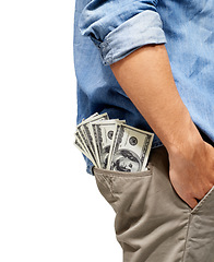 Image showing Man, hand and pocket of cash for financial freedom, profit or investment against a white studio background. Closeup of male person with money, dollar bills or savings in finance, bribe or salary