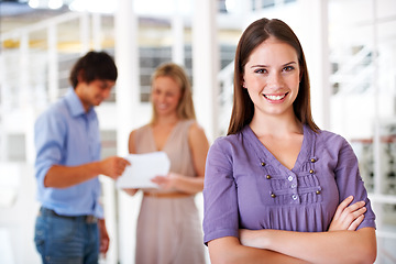 Image showing Happy, crossed arms and portrait of business woman with team for leadership, confidence and pride. Office, company and face of worker with staff for meeting, planning and collaboration in workplace