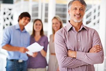 Image showing Office, crossed arms and portrait of business man with team for leadership, confidence and pride. Corporate, company and happy worker with staff for meeting, planning and collaboration in workplace