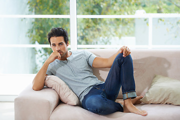 Image showing Man, portrait and sofa relax in home for weekend rest or holiday calm, chill on vacation morning. Male person, face and living room peace or thinking casual confident in apartment, break or comfort