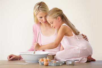 Image showing Bowl, spoon and baking mom, child or family mix ingredients, food or prepare meal, flour or recipe. Home kitchen counter, teaching and kid learning youth development skills, cooking or how to bake