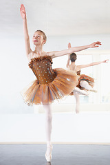 Image showing Ballerina, dancing and ballet dancer studio with training, exercise and performance workout. Tutu, balance and pointe with a female athlete and happy with practice and confidence with pose and smile