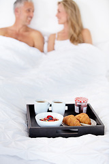 Image showing Happy couple, bed and breakfast for morning, wakeup or room service in romance at hotel suite. Man and woman smile with food, meal or snack tray in bedroom of jam jar croissant, coffee or fruit salad