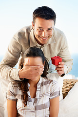 Image showing Couple, ring box and boyfriend covering eyes for surprise, smile and happy for love, wife and engagement. Outdoor, secret and news for marriage, relationship and announcement with excitement