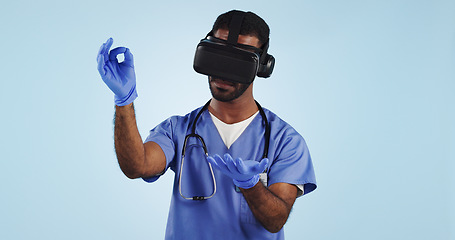 Image showing Nurse, man and virtual reality glasses for surgery, healthcare innovation and surgeon on a blue studio background. Doctor, medical and professional with VR eyewear, future and tech with digital app