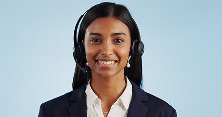 Image showing Happy woman, portrait and headphones for call center or telemarketing against a blue studio background. Face of female person, consultant or agent smile with mic for online advice on mockup space
