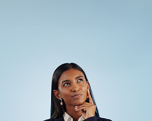 Image showing Thinking space, solution or businesswoman in studio for problem solving on blue background. Ideas, doubt or decision with an Indian attorney or lawyer contemplating a thought, choice or legal option