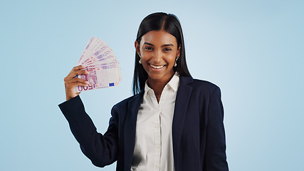 Image showing Happy business woman, portrait and money fan in financial freedom against a blue studio background. Excited female person or employee with cash, savings or investment for bonus salary on mockup space