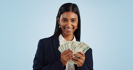 Image showing Business woman, portrait and money in financial freedom against a blue studio background. Happy female person or employee with cash, savings or dollar bills for bonus salary or investment on mockup