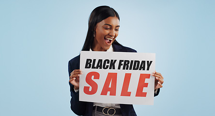 Image showing Business woman, sale and sign for discount, advertising or deal against a blue studio background. Shocked female person with billboard, poster or wow for marketing, promotion or Black Friday special