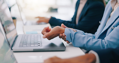 Image showing Business people, closeup and woman with wrist pain in office from laptop, strain or problem. Hands, injury and female manager online with carpal tunnel, arthritis and fibromyalgia or osteoporosis