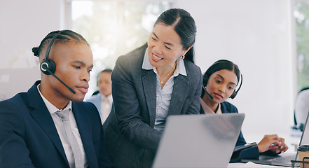 Image showing Call center, customer support and manager with consultant in the office helping with online consultation. Contact us, telemarketing and mature female person talking to black man agent in workplace.