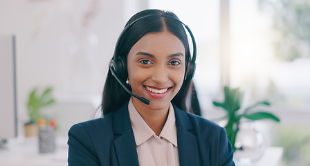 Image showing Happy woman, portrait and headphones in call center for customer service or support at office. Face of friendly Indian female person, consultant or agent smile for online advice or help at workplace