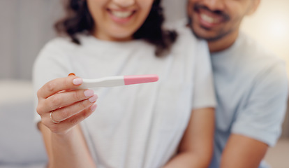 Image showing Excited couple, hands and positive pregnancy test for maternity, start or family at home. Closeup of happy man and pregnant woman smile for parenthood, morning or good news or results in bedroom