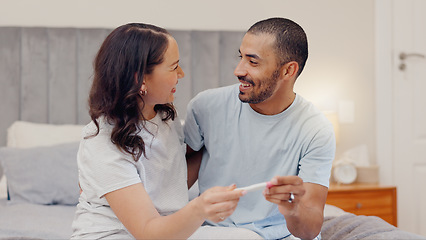 Image showing Excited couple, bed and positive pregnancy test for family, start or maternity at home. Face of happy man and pregnant woman smile for parenthood, morning or good news or results in bedroom together