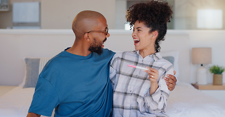 Image showing Excited couple, bed and positive pregnancy test for maternity, family or start at home. Closeup of happy man and pregnant woman smile for parenthood, morning or good results in bedroom together