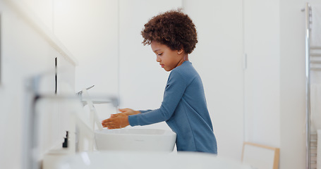 Image showing Child, tap and washing or cleaning hands for hygiene, bacteria or germ removal in sink at home. Little boy or kid rinsing soap in bathroom, water or basin for disinfection or cleanliness at house