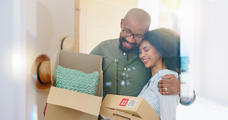 Image showing Real estate, box and hug with a black couple moving house for growth, investment or mortgage. Property, love or smile with a happy man and woman in their new home or apartment together for romance