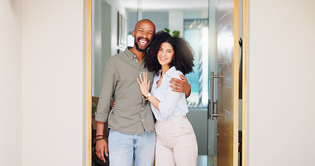 Image showing African couple, happy and hug at front door in portrait with pride, care and bonding at new home. Man, woman and smile together with embrace, love and investment with property, real estate or house