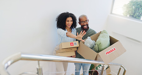 Image showing Real estate, box and vision with a black couple moving house for growth, investment or mortgage. Property, smile or happy with a man and woman on stairs in their new home together for future planning