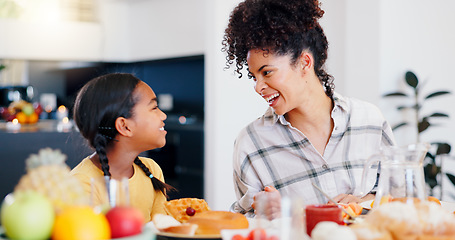 Image showing Happy, breakfast and mother eating with kid in dining room at modern home together for bonding. Smile, love and young mom enjoying healthy morning food and juice with girl child at family house.