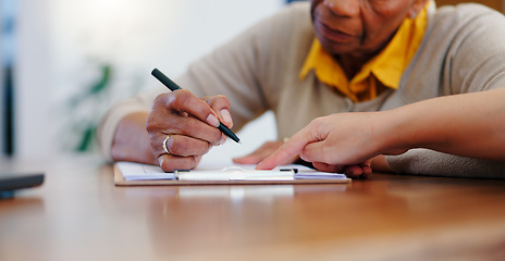 Image showing Senior woman, hands and writing on contract, form or application for retirement plan or insurance at home. Closeup of elderly female person signing documents, paperwork or agreement on table at house