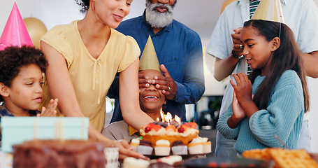 Image showing Cake, surprise and family at birthday party celebration together at modern house with candles and cake. Smile, excited and young children with African father and grandparents for dessert at home.