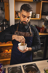 Image showing Barman preparing matcha latte
