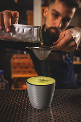 Image showing Barman decorated matcha latte