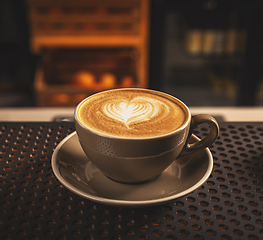 Image showing Cup of coffee with heart pattern