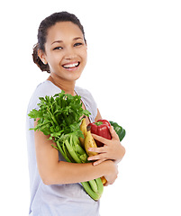 Image showing Vegetables, grocery shopping and happy woman in studio for healthy food, sustainability or diet. Portrait of vegan customer or model with fruits for discount, sale or nutrition on a white background