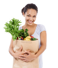 Image showing Vegetables, shopping portrait and happy woman in studio for healthy food, sustainability or diet. Young person, customer or model with bag of groceries for discount or nutrition on a white background