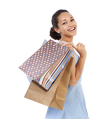 Image showing Woman, happy portrait and shopping bag in studio with discount, sale and retail giveaway for commerce. Fashion winner, model or African customer with holiday gift or clothes on a white background