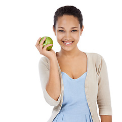 Image showing Portrait, apple and happy woman in studio with healthy food choice, healthcare or nutrition benefits. Face of person or model with green fruit for detox, self care or vegan diet on a white background