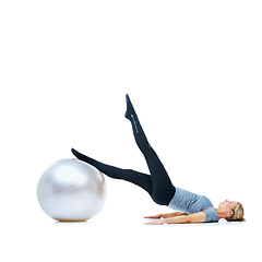 Image showing Woman, exercise ball or legs balance in studio for workout performance, wellness or white background. Flexible female athlete, training equipment or fitness for mockup space, challenge or stretching