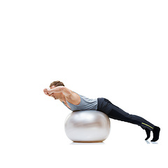 Image showing Fitness, training and man with exercise ball in studio for abs, core or balance challenge on white background. Workout, body or male athlete with inflatable for wellness, sports or stretching routine