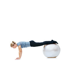 Image showing Yoga ball, fitness and woman in studio with body, health and wellness exercise for balance. Sports, equipment and young female athlete with stretching workout or training isolated by white background