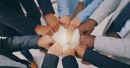 Image showing Business people, teamwork and fist of hands in circle for collaboration, synergy and motivation of global equality from above. Closeup, corporate group and cooperation for support, inclusion or trust