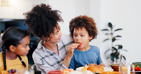 Image showing Black family, fruit and mother with children for breakfast, lunch and eating together in home. Happy, parents and mom and kids at table for bonding with meal for health, nutrition and hunger in house