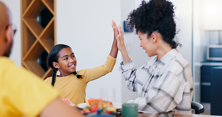 Image showing Smile, high five and a family eating breakfast in the kitchen of home together in the morning for health. Food, love or support with a mother and daughter bonding or enjoying a meal for nutrition