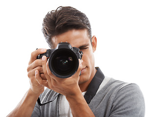 Image showing Photographer, man and camera in studio for digital photoshoot, creative production and content creation on white background. Journalist, cameraman and multimedia artist click lens for photography