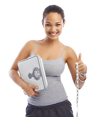 Image showing Woman, portrait and scale for weightloss in studio, smiling and excited for exercise by white background. Female person, measuring tape and confidence for fitness goals, wellness and diet for health