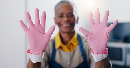 Image showing Hands, hygiene and gloves for cleaning with person housekeeper in home kitchen at hospitality guest house. Safety, service and pink rubber or latex with cleaner in apartment for housekeeping chores