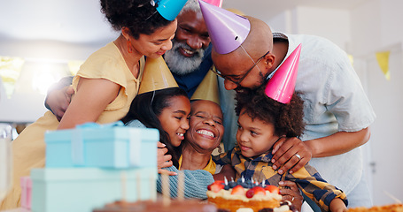 Image showing Happy black family, birthday and bonding in celebration for party, holiday or special day together at home. Excited African grandma smile with hug in unity, love or care for event, cake and candles